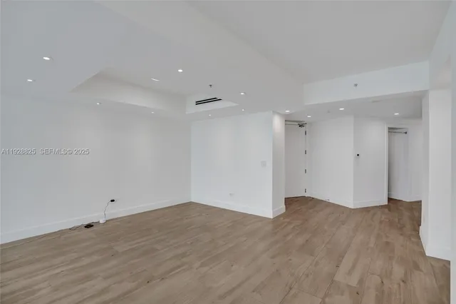a bathroom with double vanity sinks and a mirror