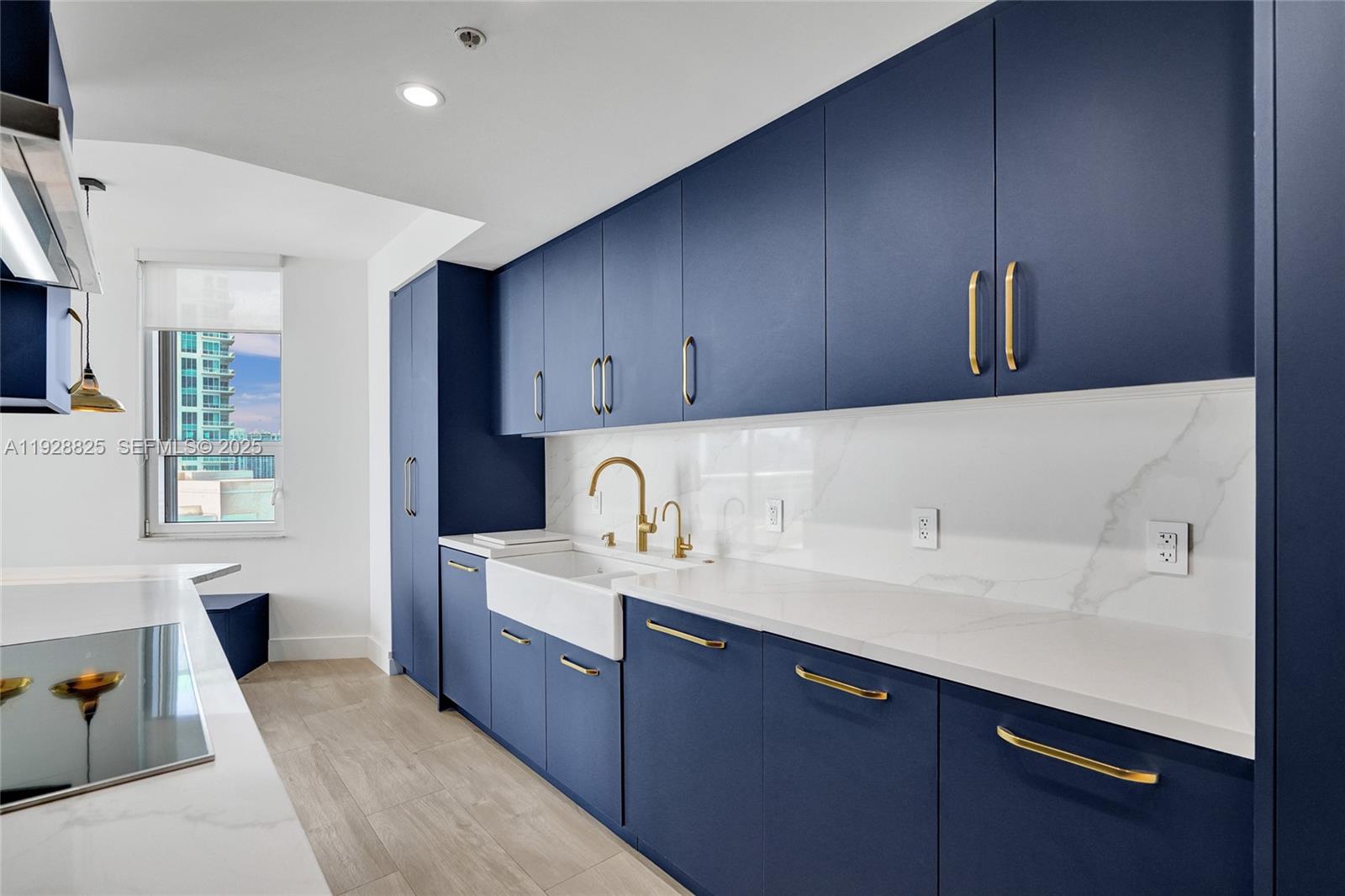 848 Brickell Key Drive, Unit 3206 Miami, FL 33131 - Photo 21 of 93 a kitchen with a sink cabinets and window