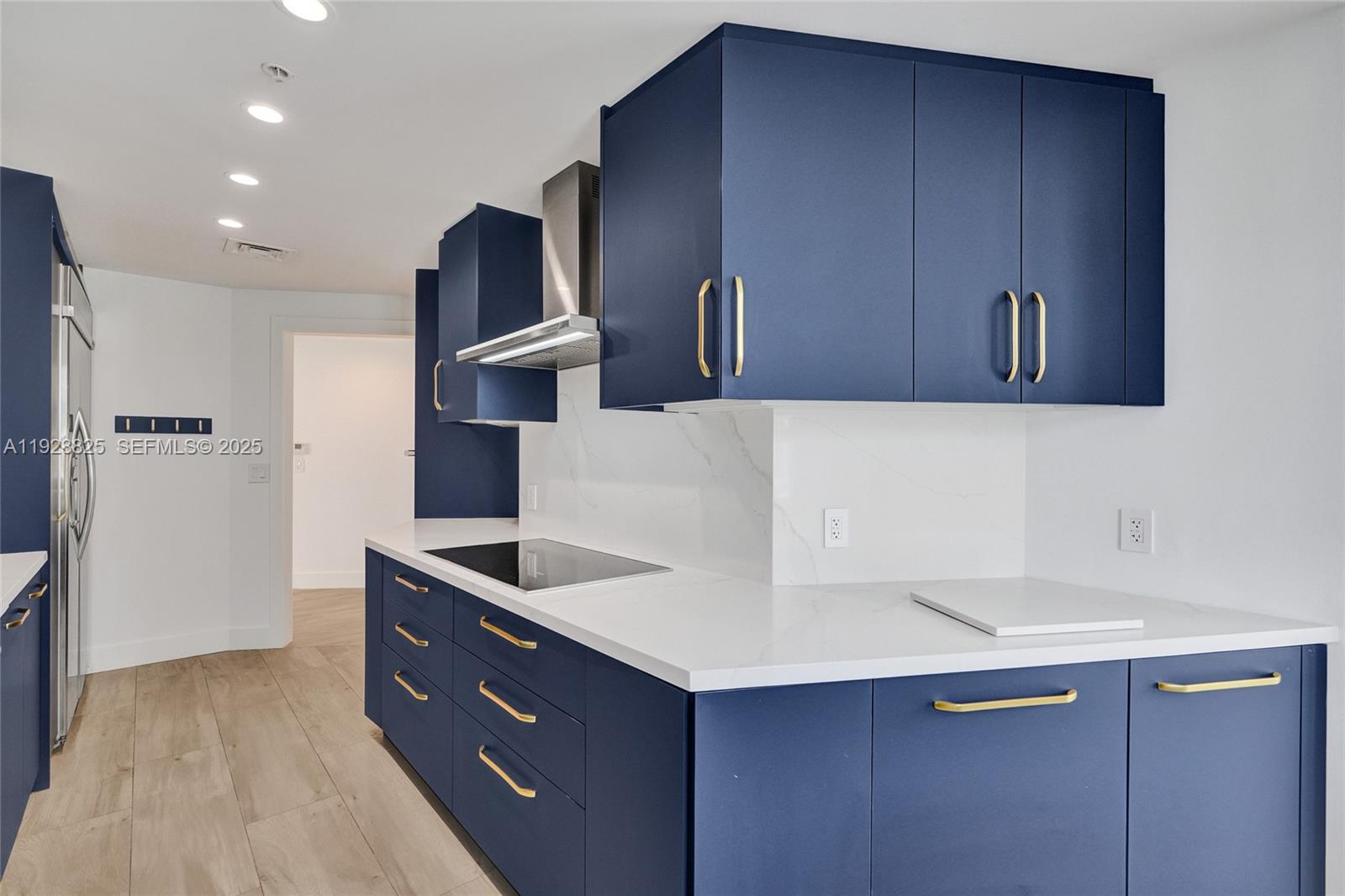 848 Brickell Key Drive, Unit 3206 Miami, FL 33131 - Photo 24 of 93 a kitchen with stainless steel appliances granite countertop a sink and a refrigerator