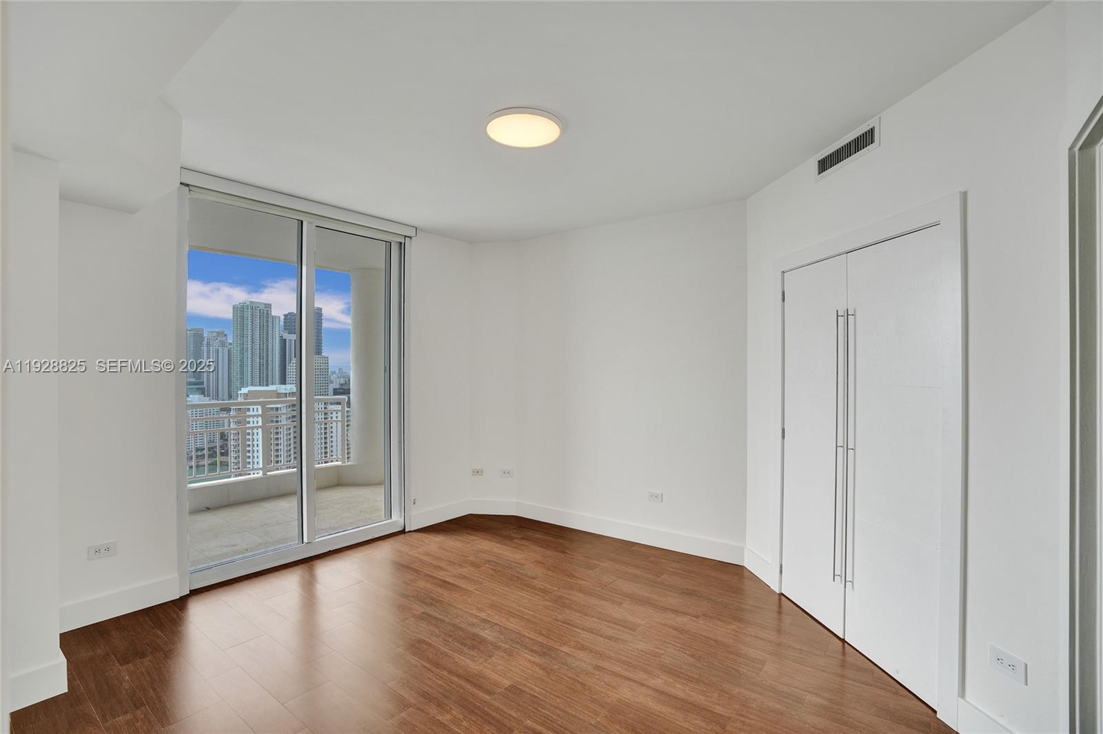 848 Brickell Key Drive, Unit 3206 Miami, FL 33131 - Photo 45 of 93 wooden floor in an empty room