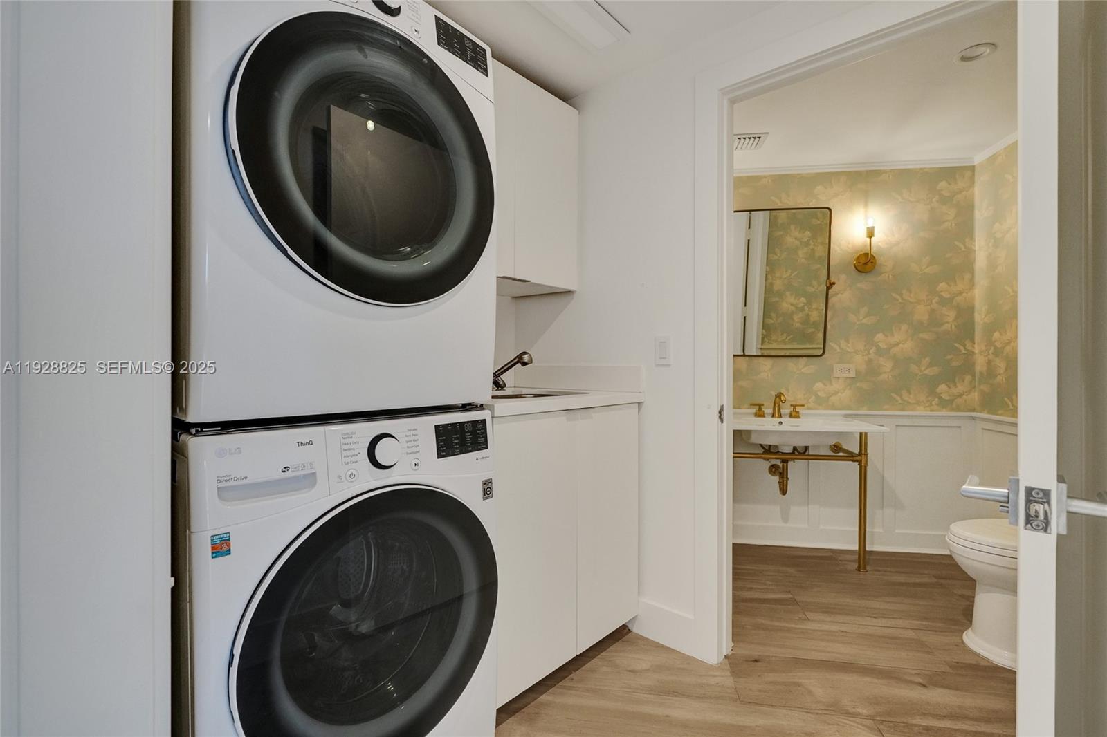 848 Brickell Key Drive, Unit 3206 Miami, FL 33131 - Photo 52 of 93 a view of a hallway with washer and dryer