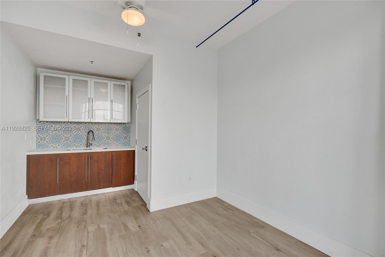 848 Brickell Key Drive, Unit 3206 Miami, FL 33131 - Photo 55 of 93 a view of room with wooden floor and window