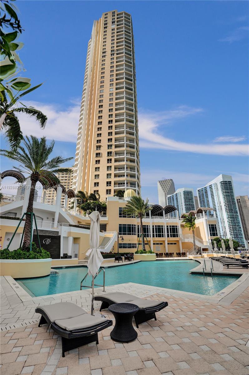 848 Brickell Key Drive, Unit 3206 Miami, FL 33131 - Photo 84 of 93 a view of a building with a swimming pool