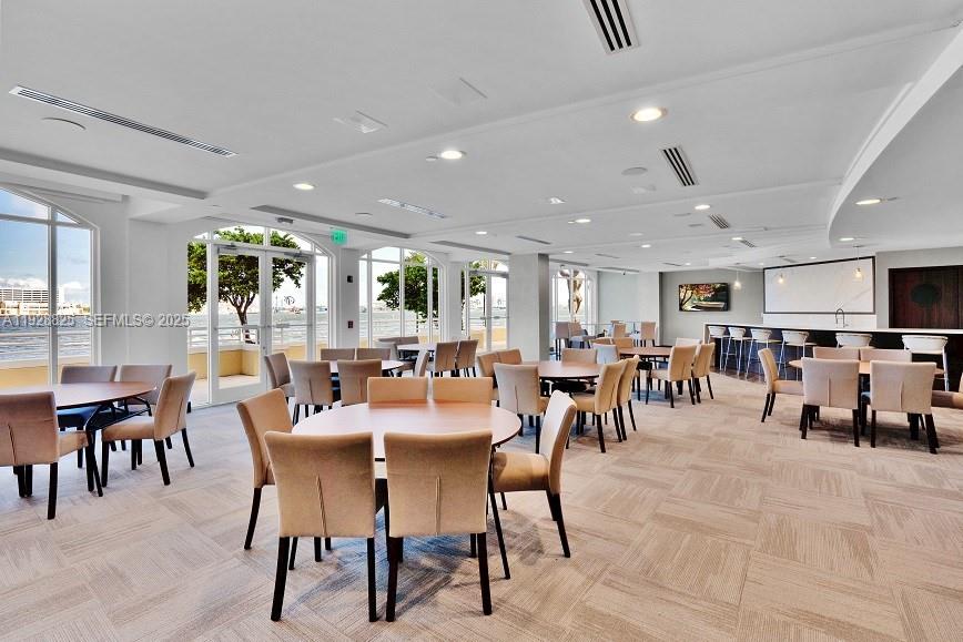 848 Brickell Key Drive, Unit 3206 Miami, FL 33131 - Photo 89 of 93 a view of a dining area with furniture and a table