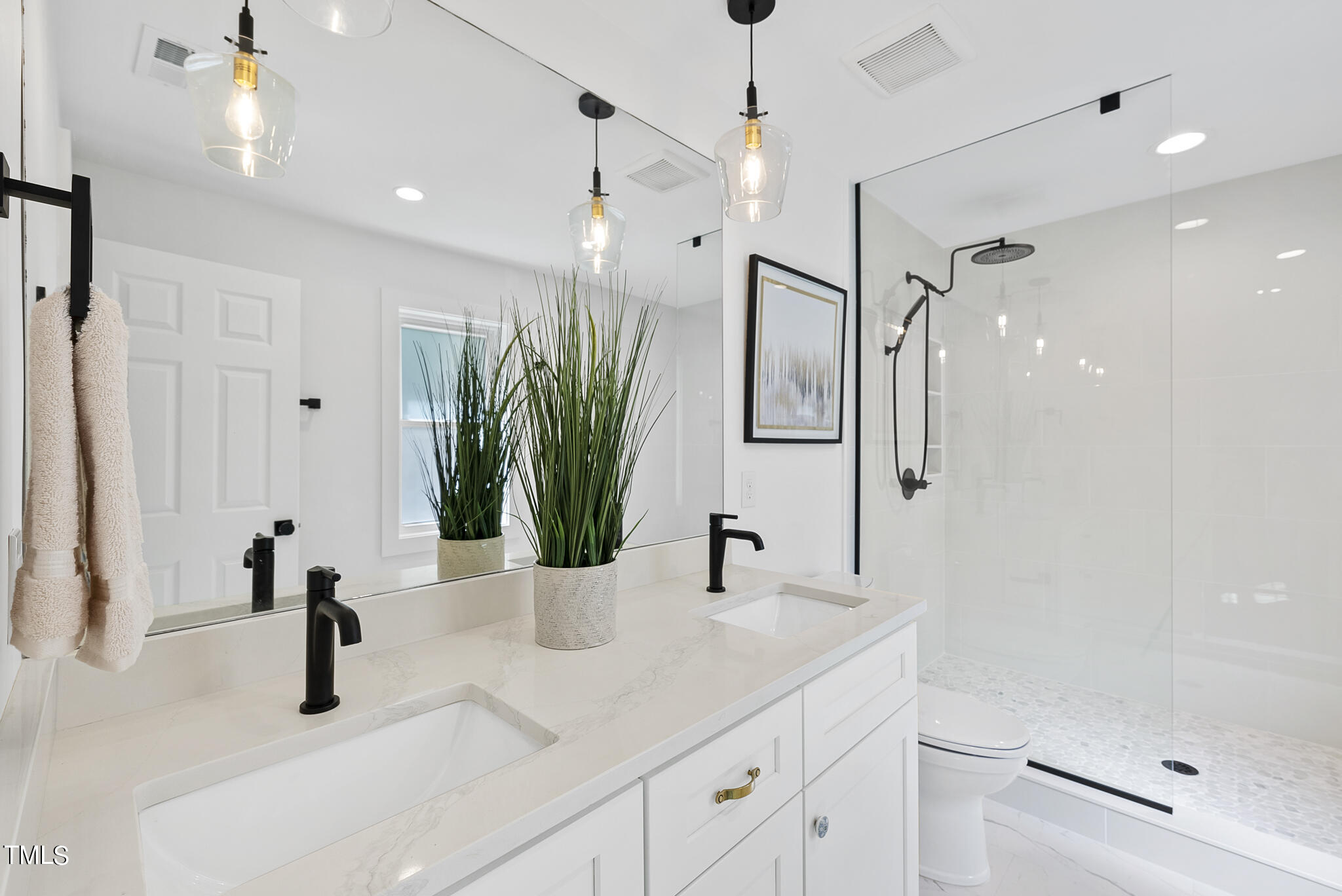 2115 Port Royal Road Raleigh, NC 27609 - Photo 33 of 50 a bathroom with a sink and a mirror