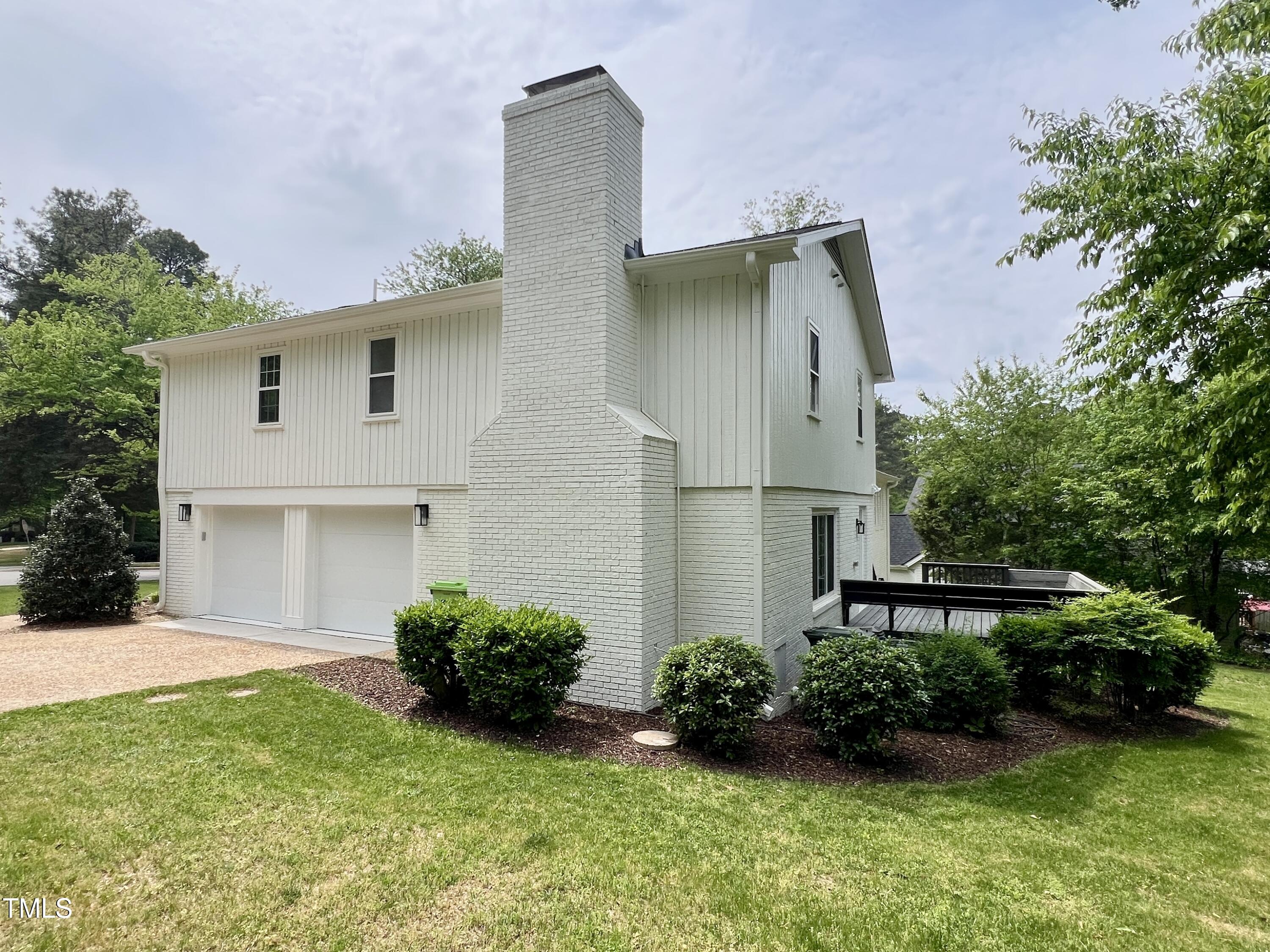 2115 Port Royal Road Raleigh, NC 27609 - Photo 39 of 50 a front view of a house with garden