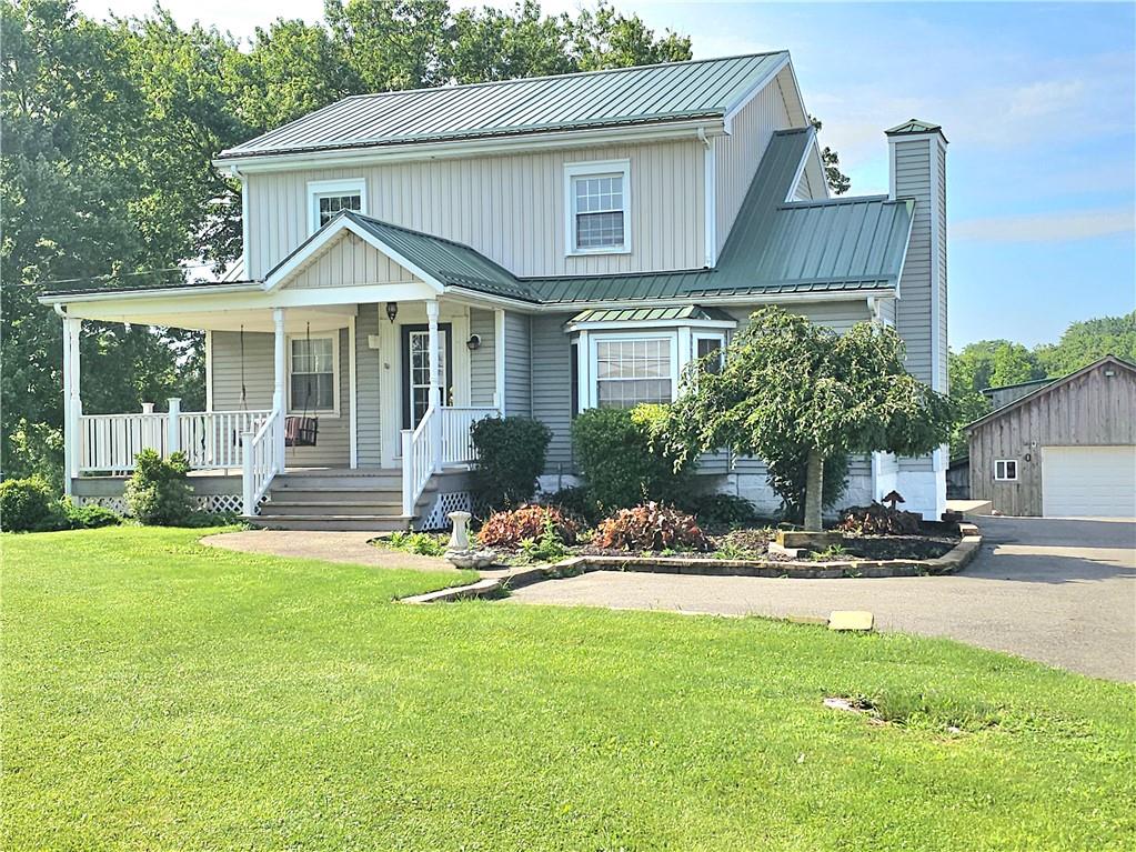 342 Concord Church Road Beaver Falls, PA 15010 - Photo 1 of 44 a front view of a house with a yard table and chairs