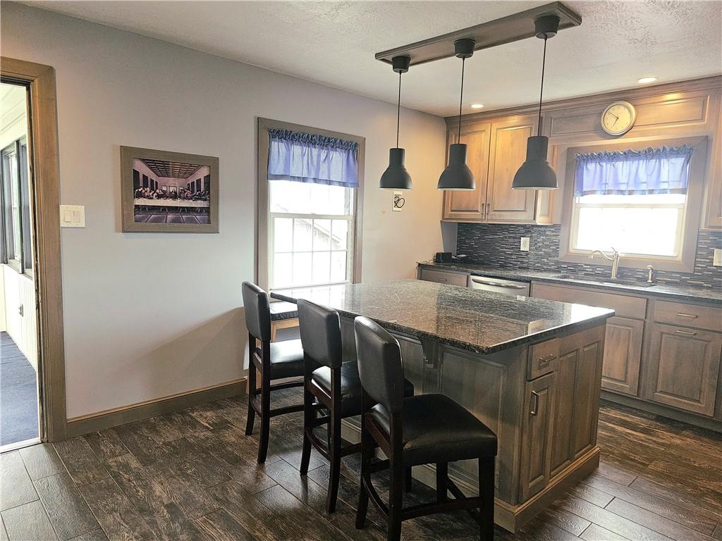 342 Concord Church Road Beaver Falls, PA 15010 - Photo 18 of 44 a kitchen with a table chairs sink and cabinets