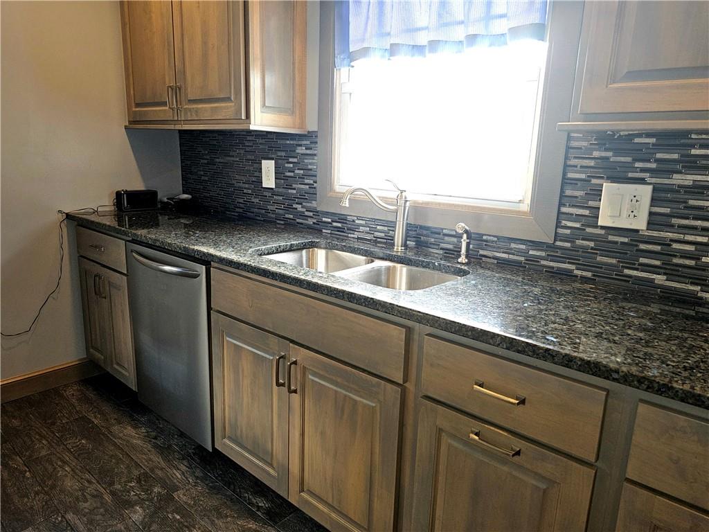342 Concord Church Road Beaver Falls, PA 15010 - Photo 20 of 44 a kitchen with granite countertop a sink and a white wooden cabinets