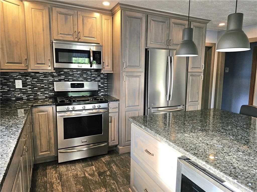 342 Concord Church Road Beaver Falls, PA 15010 - Photo 21 of 44 a kitchen with stainless steel appliances granite countertop a refrigerator stove and microwave