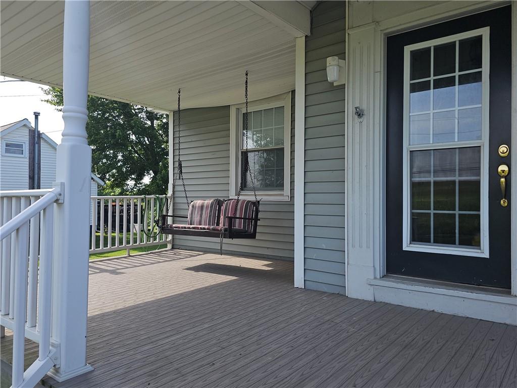 342 Concord Church Road Beaver Falls, PA 15010 - Photo 3 of 44 a porch with a bench next to a yard
