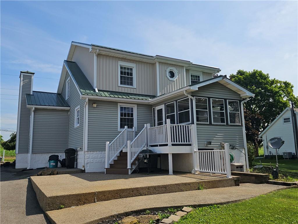 342 Concord Church Road Beaver Falls, PA 15010 - Photo 6 of 44 a front view of a house with a yard