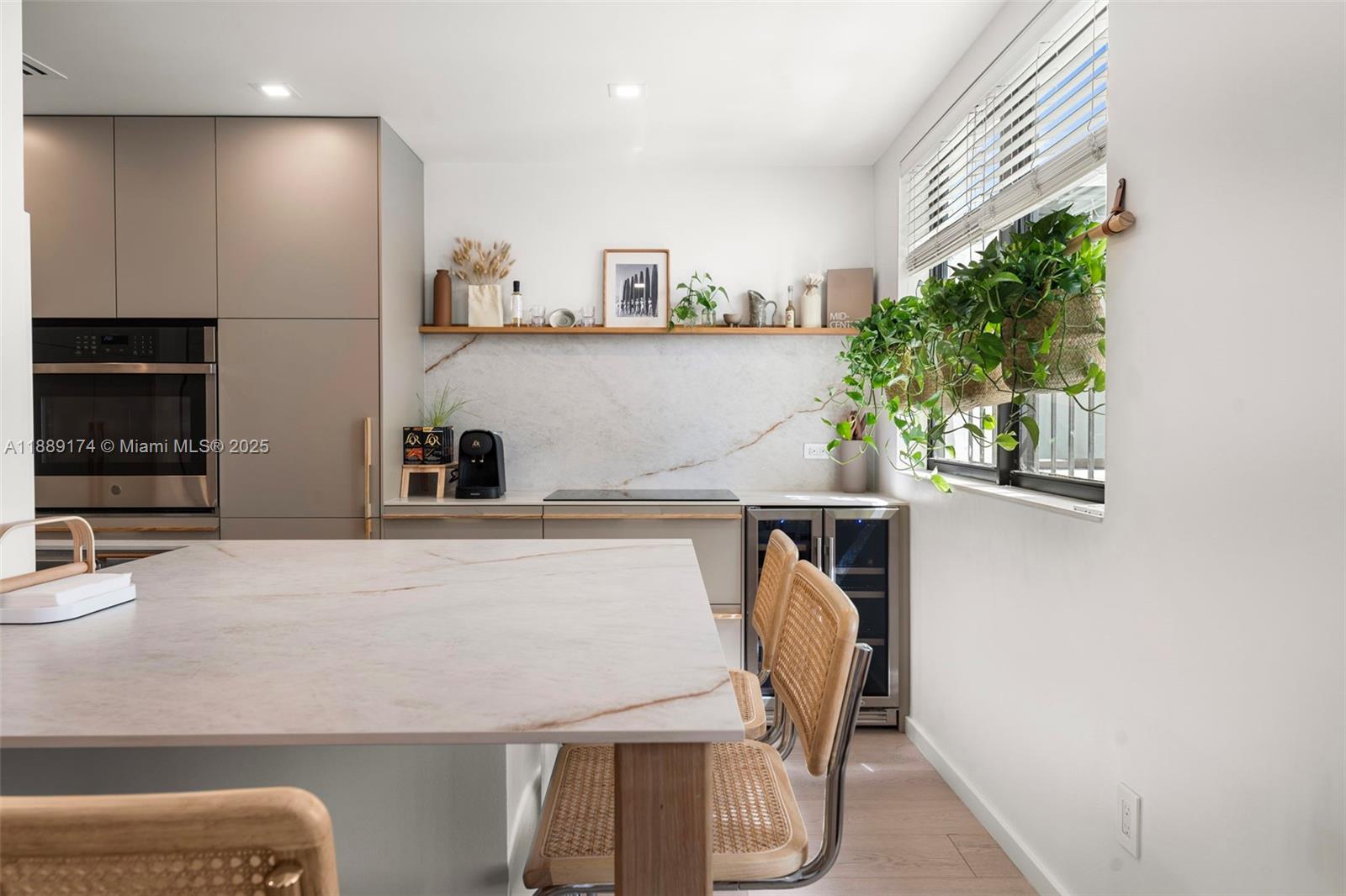 1390 Ocean Drive, Unit 202 Miami Beach, FL 33139 - Photo 16 of 80 a view of kitchen with stainless steel appliances granite countertop a sink and a refrigerator