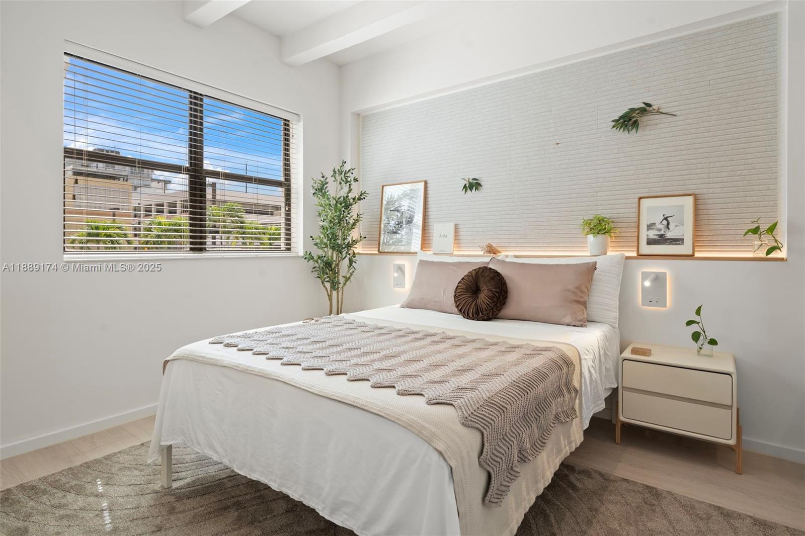 1390 Ocean Drive, Unit 202 Miami Beach, FL 33139 - Photo 18 of 80 a bedroom with a bed and wooden floor