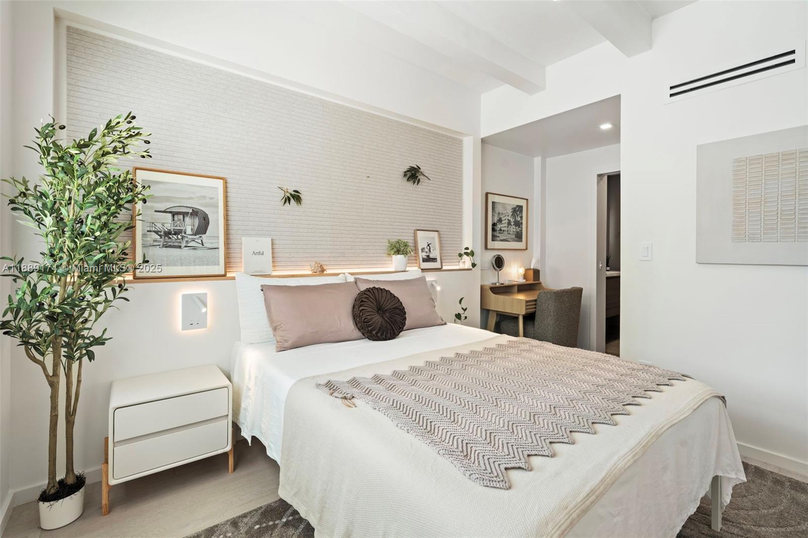 1390 Ocean Drive, Unit 202 Miami Beach, FL 33139 - Photo 23 of 80 a bedroom with a bed and a potted plant