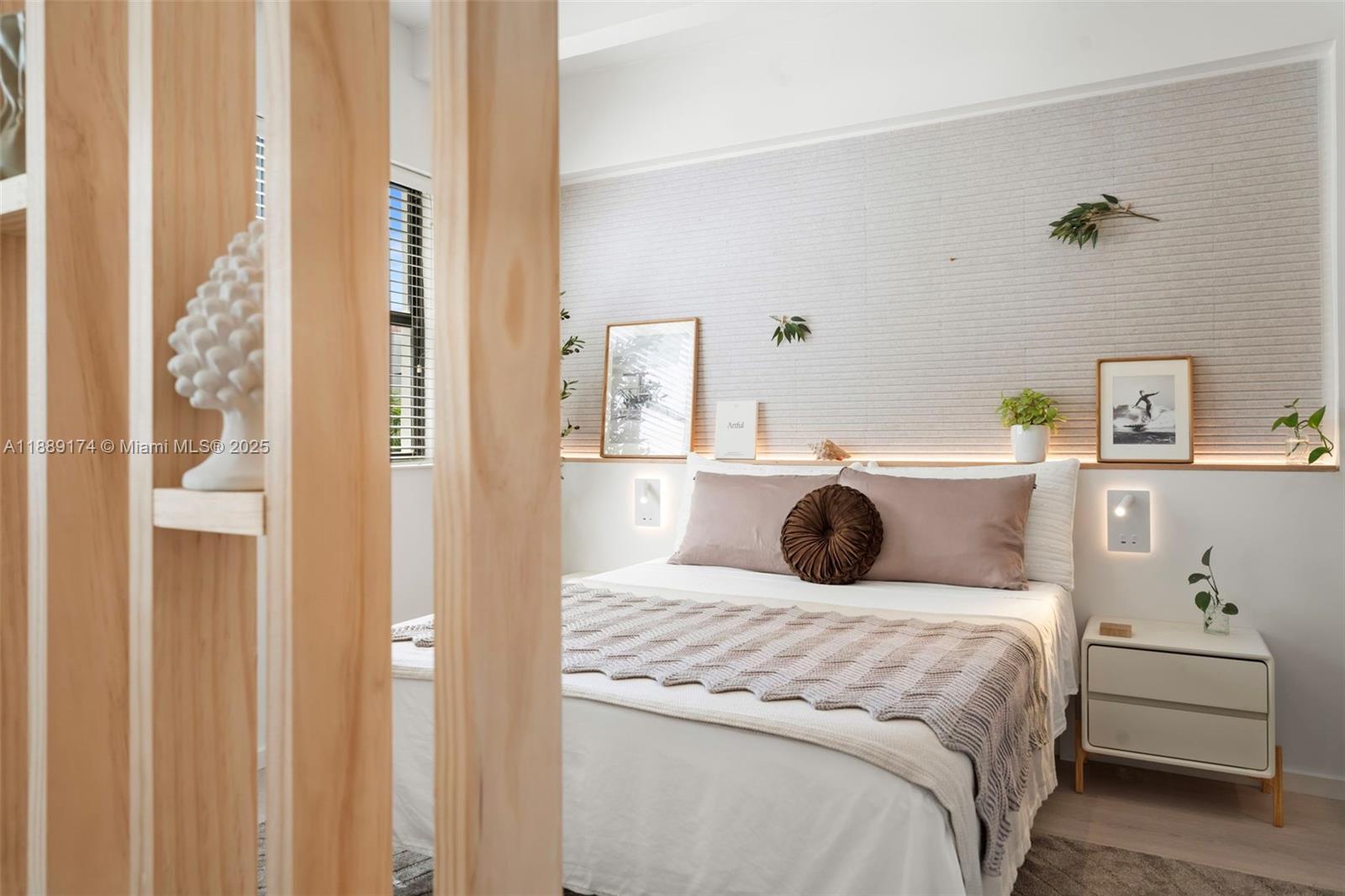 1390 Ocean Drive, Unit 202 Miami Beach, FL 33139 - Photo 27 of 80 a bedroom with a bed and a cabinets