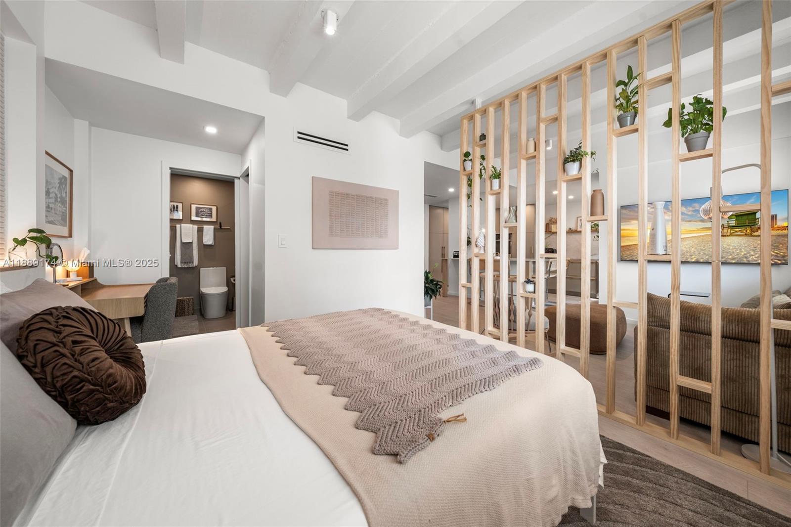 1390 Ocean Drive, Unit 202 Miami Beach, FL 33139 - Photo 30 of 80 a bedroom with a bed next to a window