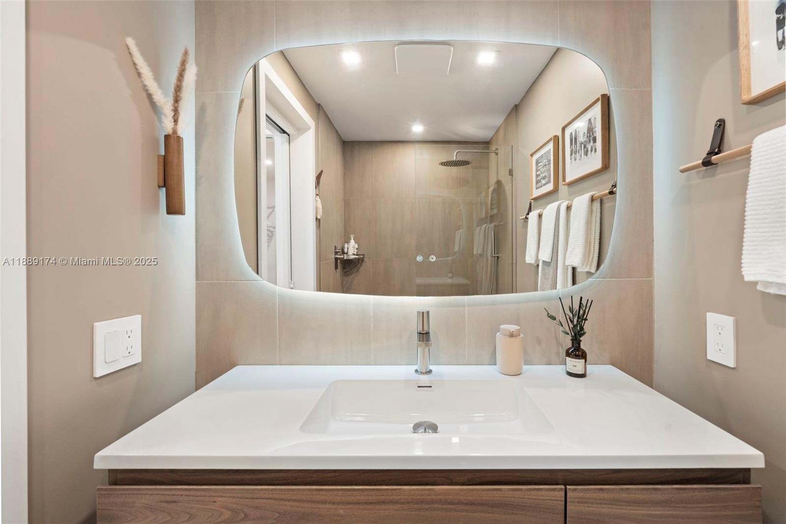 1390 Ocean Drive, Unit 202 Miami Beach, FL 33139 - Photo 31 of 80 a bathroom with a sink and a mirror