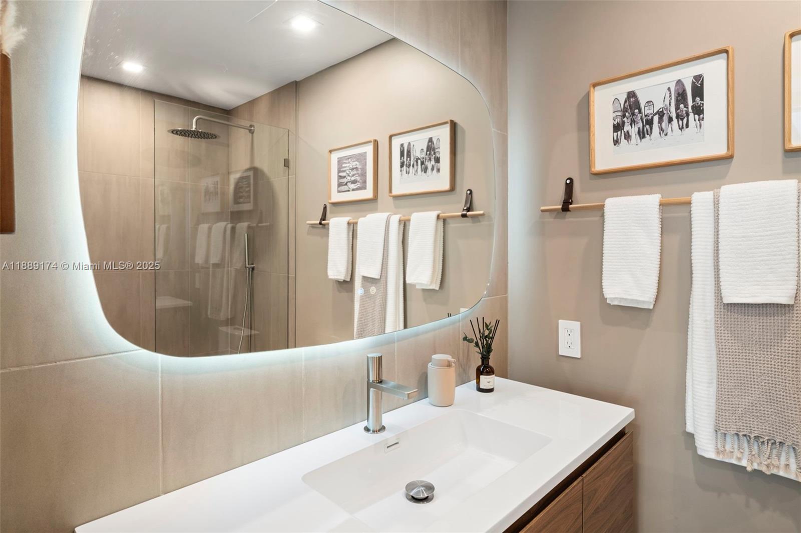 1390 Ocean Drive, Unit 202 Miami Beach, FL 33139 - Photo 33 of 80 a bathroom with a sink and a mirror