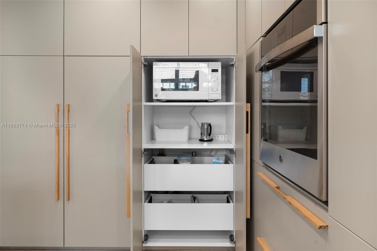 1390 Ocean Drive, Unit 202 Miami Beach, FL 33139 - Photo 35 of 80 a kitchen with a refrigerator and a window