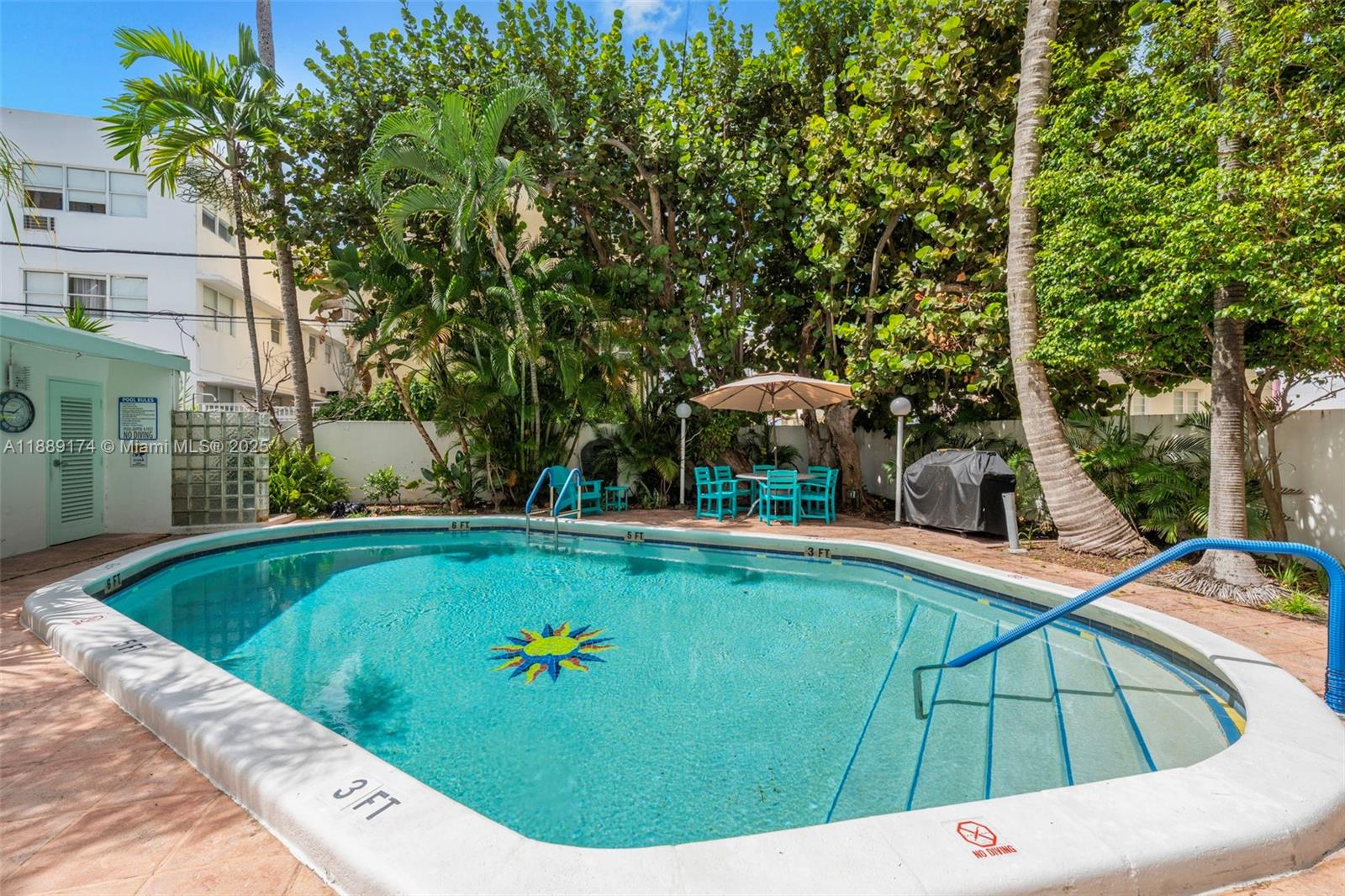 1390 Ocean Drive, Unit 202 Miami Beach, FL 33139 - Photo 48 of 80 a view of a swimming pool with a lounge chairs