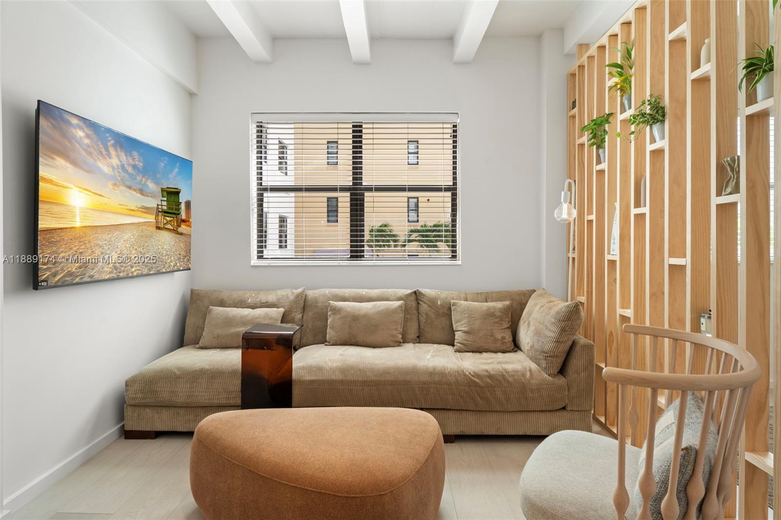 1390 Ocean Drive, Unit 202 Miami Beach, FL 33139 - Photo 6 of 80 a living room with furniture and a flat screen tv