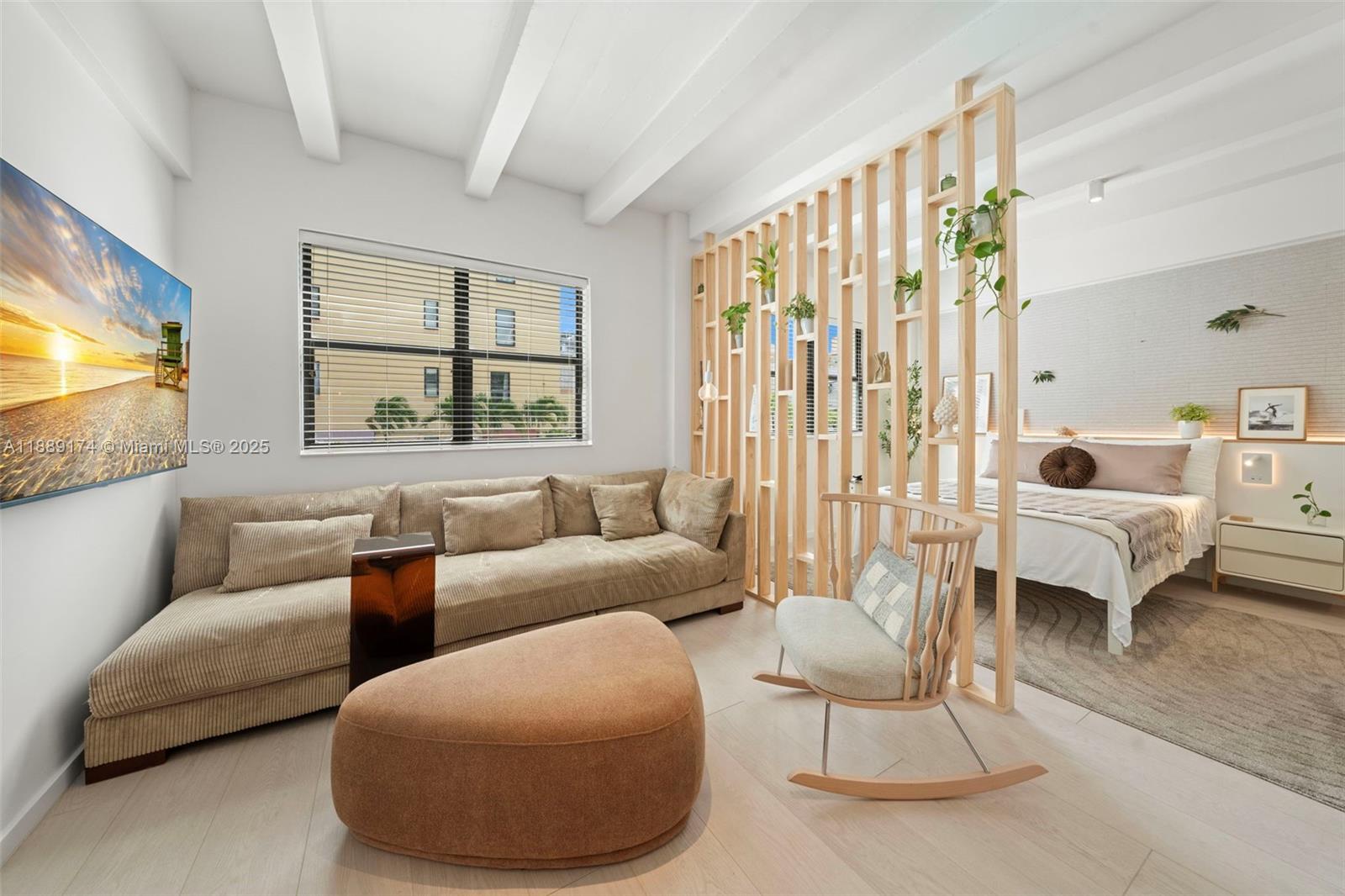 1390 Ocean Drive, Unit 202 Miami Beach, FL 33139 - Photo 7 of 80 a living room with furniture and a large window