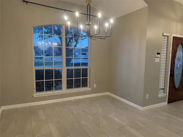 a view of empty room with windows