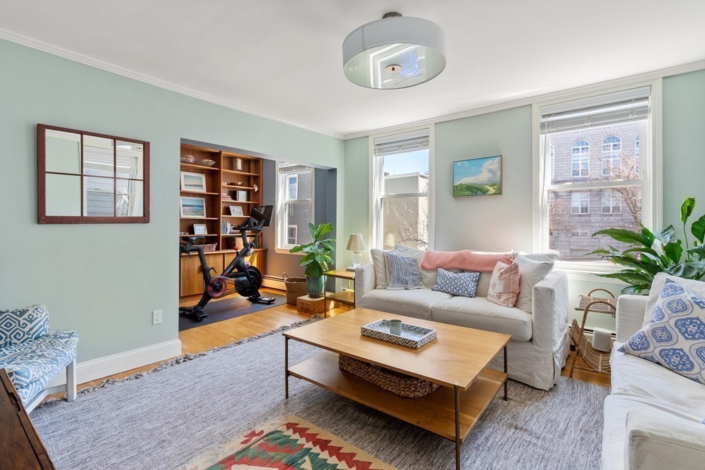 30 Cross Street, Unit 2 Boston, MA 02129 - Photo 6 of 18 a living room with furniture and a large window