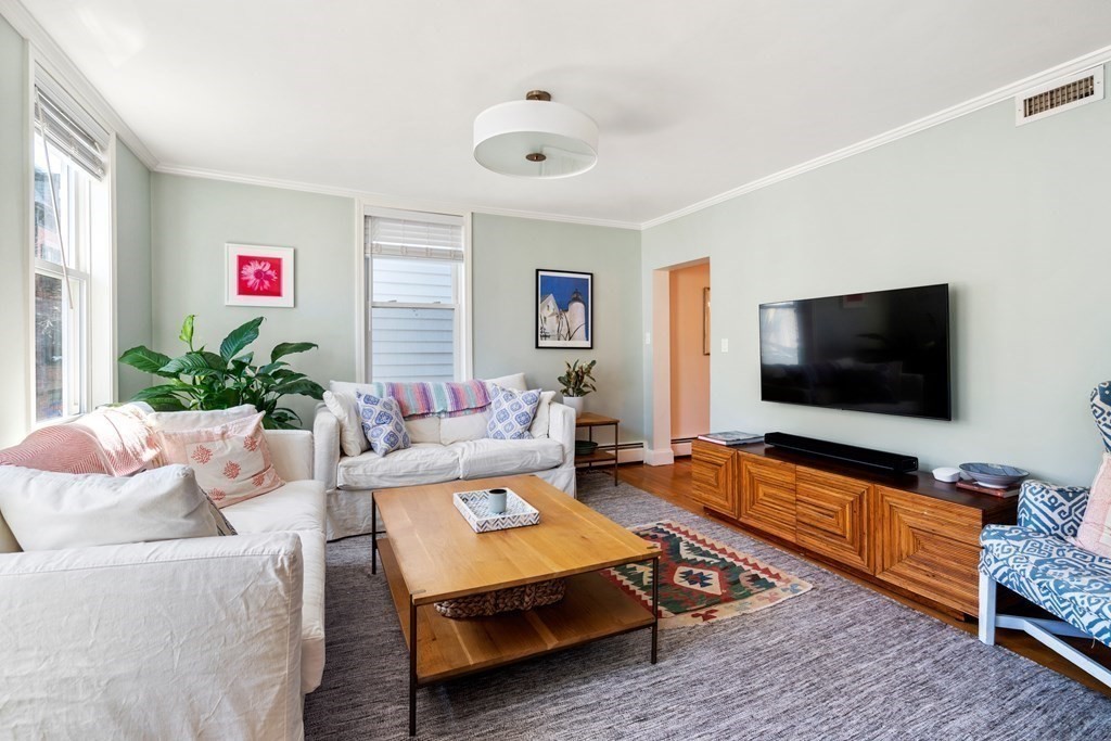 30 Cross Street, Unit 2 Boston, MA 02129 - Photo 7 of 18 a living room with furniture and a flat screen tv