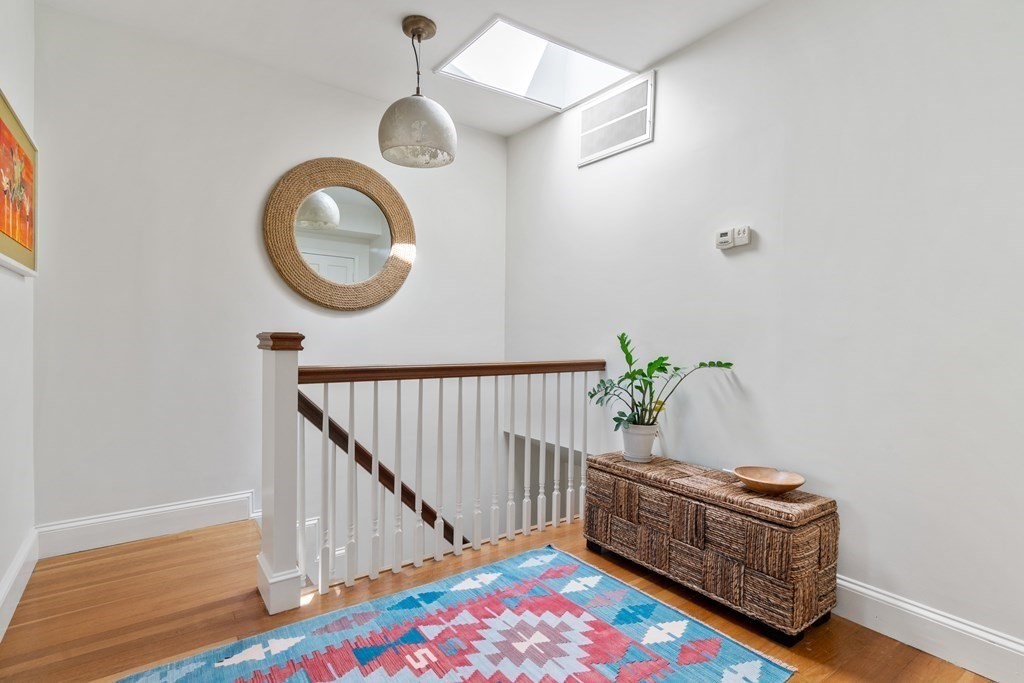 30 Cross Street, Unit 2 Boston, MA 02129 - Photo 10 of 18 a room with toys and wooden floor