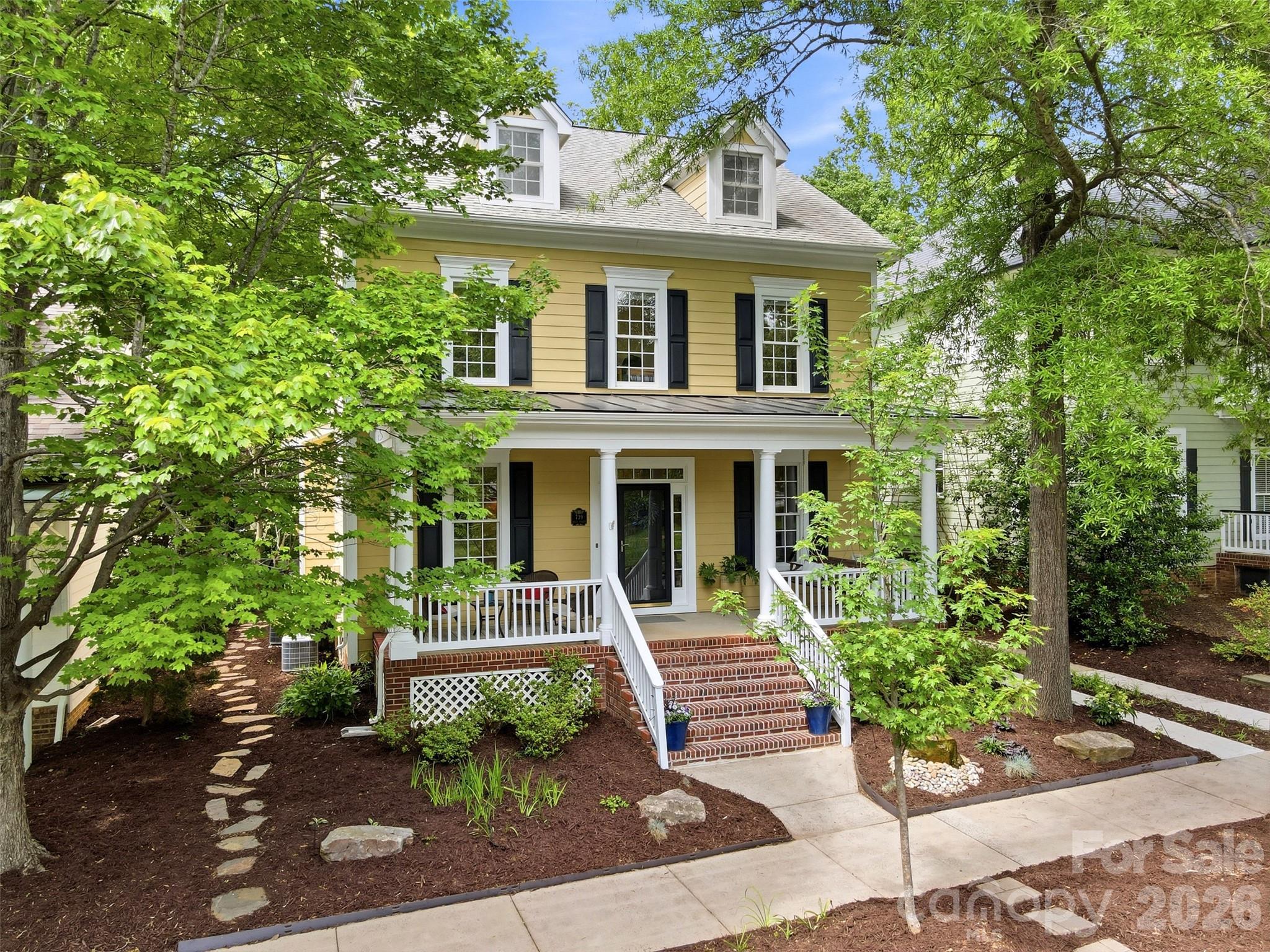 739 Julia Street Fort Mill, SC 29708 - Photo 1 of 48 a front view of a house with garden