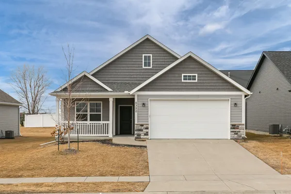 a front view of a house with a garage
