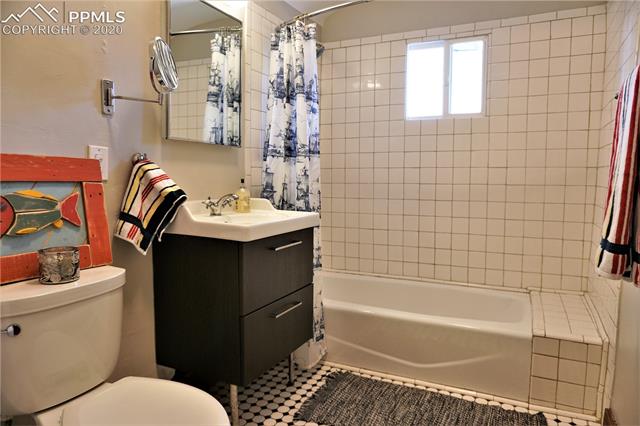 320 West Cheyenne Road Colorado Springs, CO 80906 - Photo 13 of 18 The second full bathroom has been updated with classic touches and wonderful character.