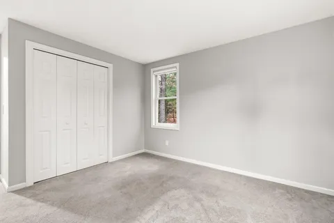 a front view of a house with a yard outdoor seating and barbeque oven