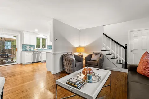 a kitchen with stainless steel appliances granite countertop a refrigerator sink and stove