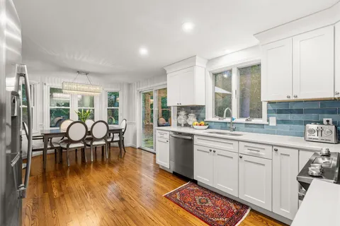 a view of entryway with wooden floor and stairs
