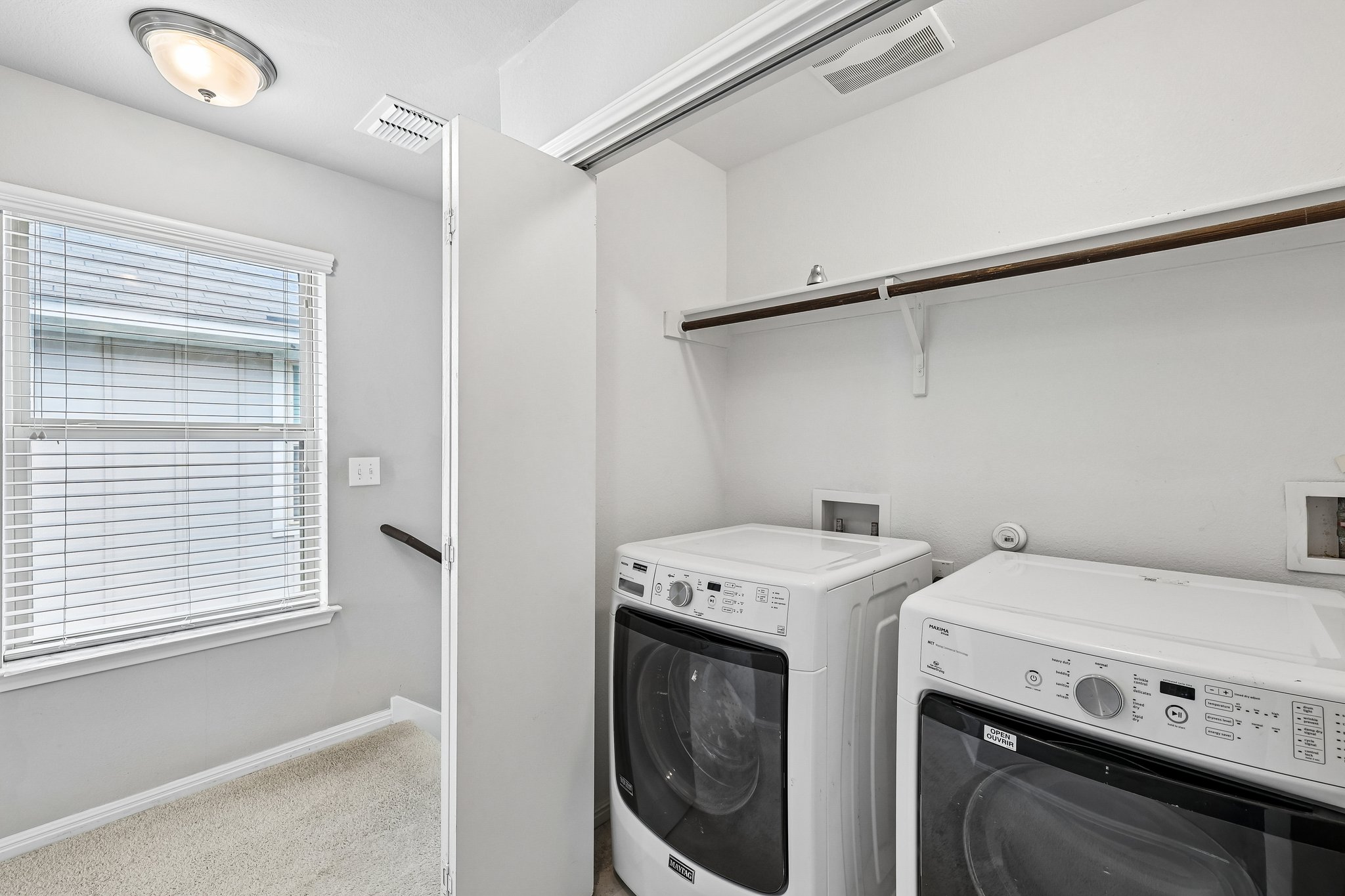 387 Guemal Road Buda, TX 78610 - Photo 19 of 39 Dedicated laundry area featuring a built-in shelf and hanging rod