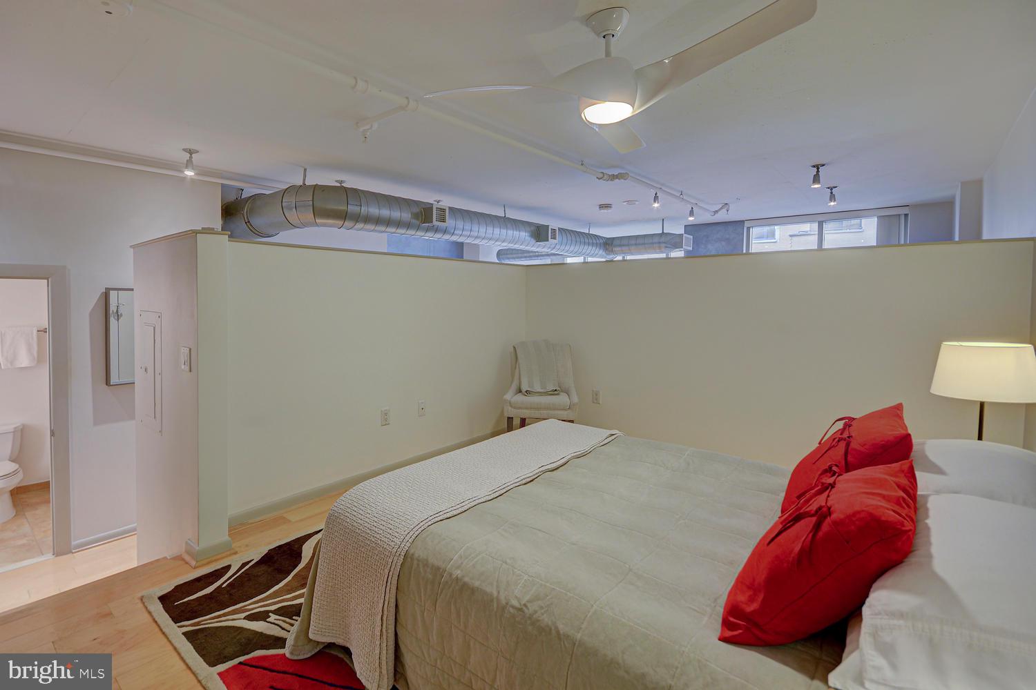 811 4th Street Northwest, Unit 507 Washington, DC 20001 - Photo 11 of 23 a bed room with a bed and a couch