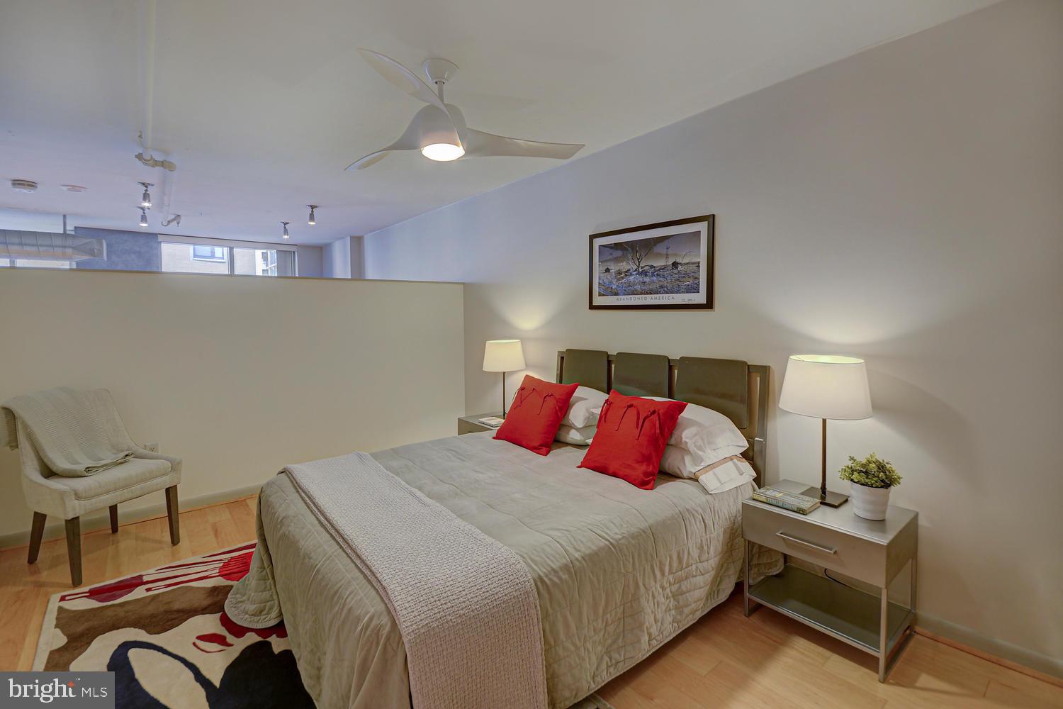 811 4th Street Northwest, Unit 507 Washington, DC 20001 - Photo 12 of 23 a bedroom with a bed and a desk