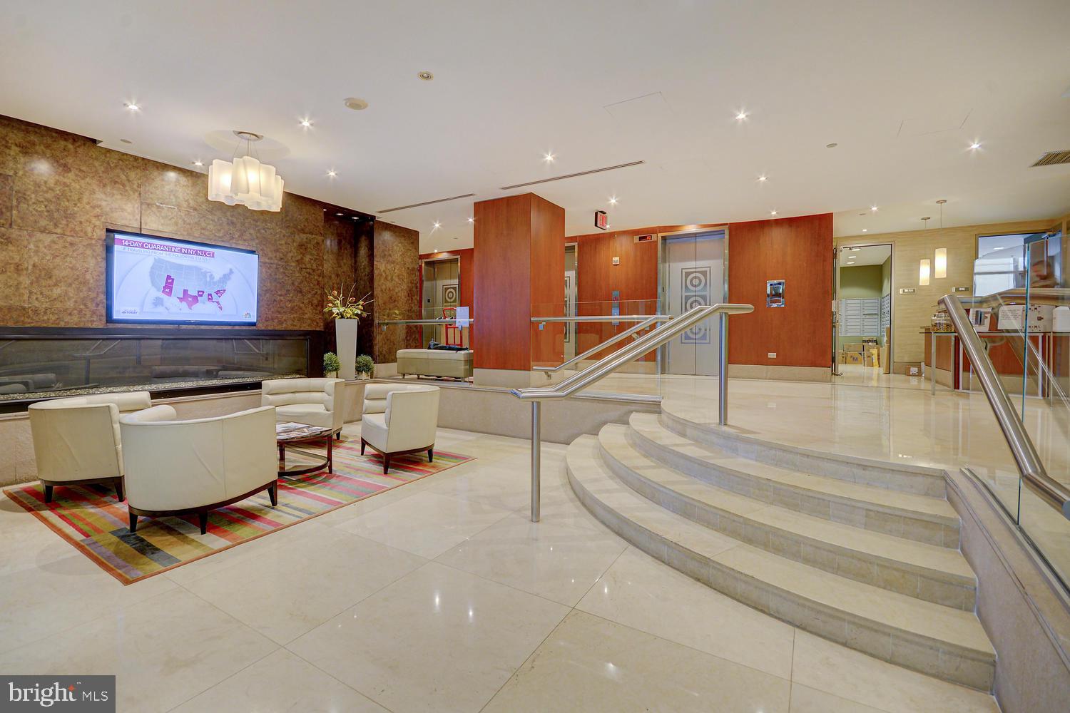 811 4th Street Northwest, Unit 507 Washington, DC 20001 - Photo 3 of 23 a living room with lots of furniture and a flat screen tv