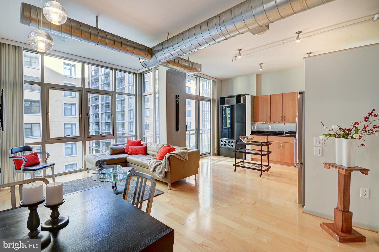 811 4th Street Northwest, Unit 507 Washington, DC 20001 - Photo 4 of 23 a living room with furniture and floor to ceiling windows