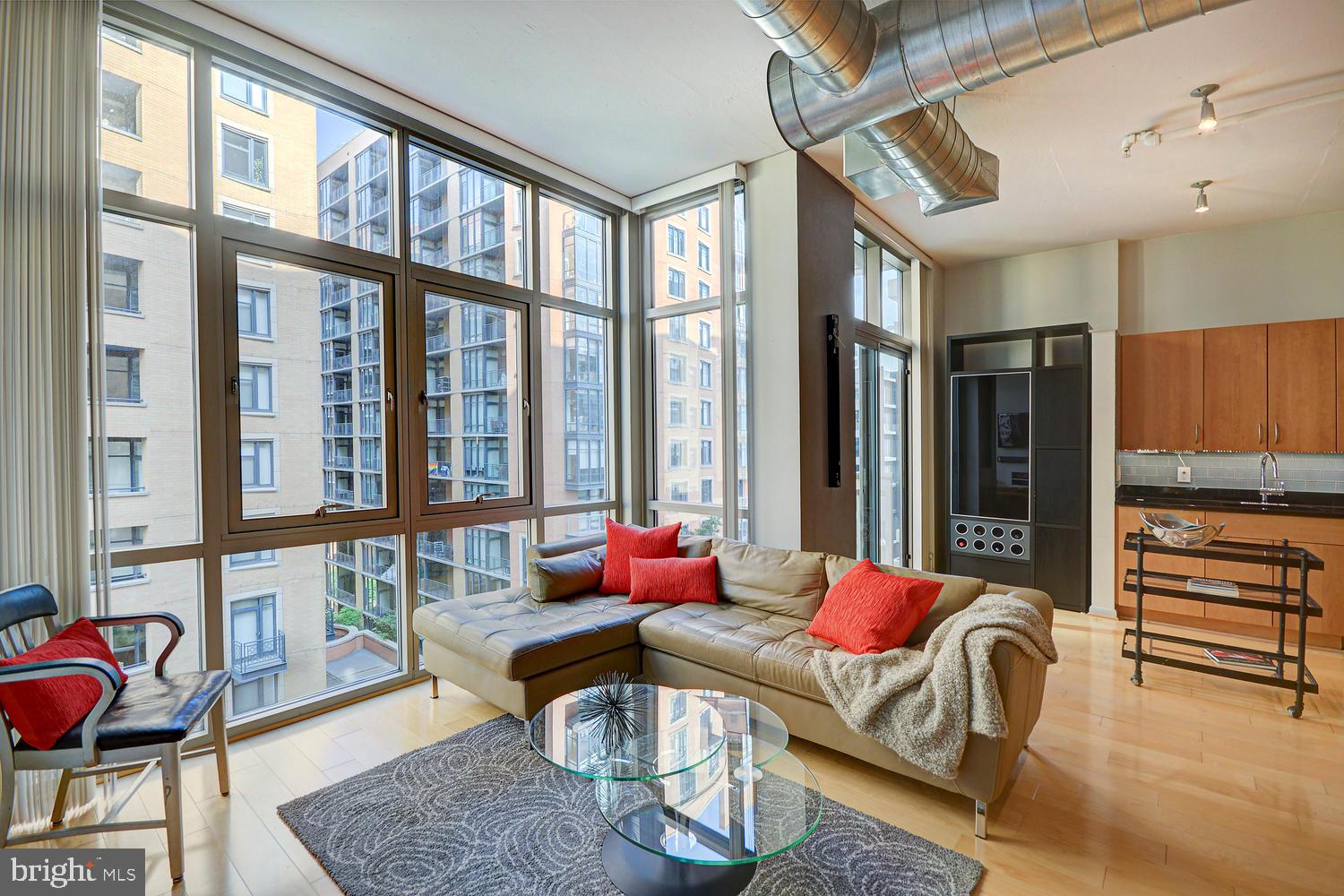 811 4th Street Northwest, Unit 507 Washington, DC 20001 - Photo 5 of 23 a living room with furniture fireplace and a large window