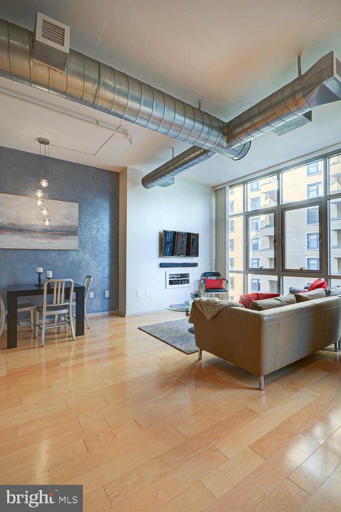 811 4th Street Northwest, Unit 507 Washington, DC 20001 - Photo 8 of 23 a living room with furniture and a flat screen tv