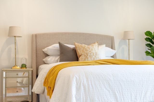 a bedroom with a bed and dresser