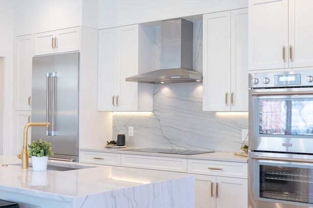 a kitchen with a sink and a stove