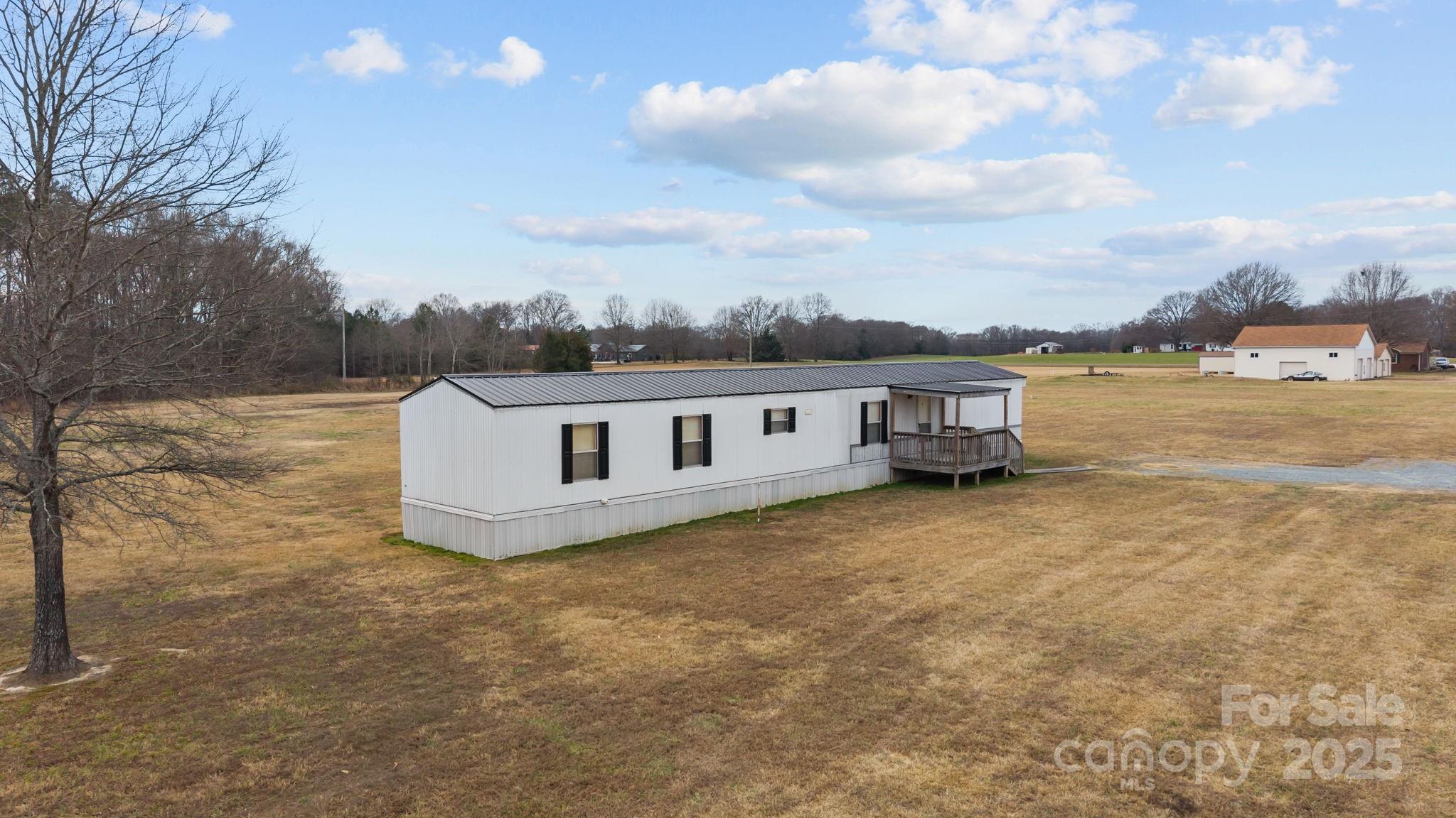 2909 New Town Road Monroe, NC 28110 - Photo 19 of 31 a view of a house with a yard