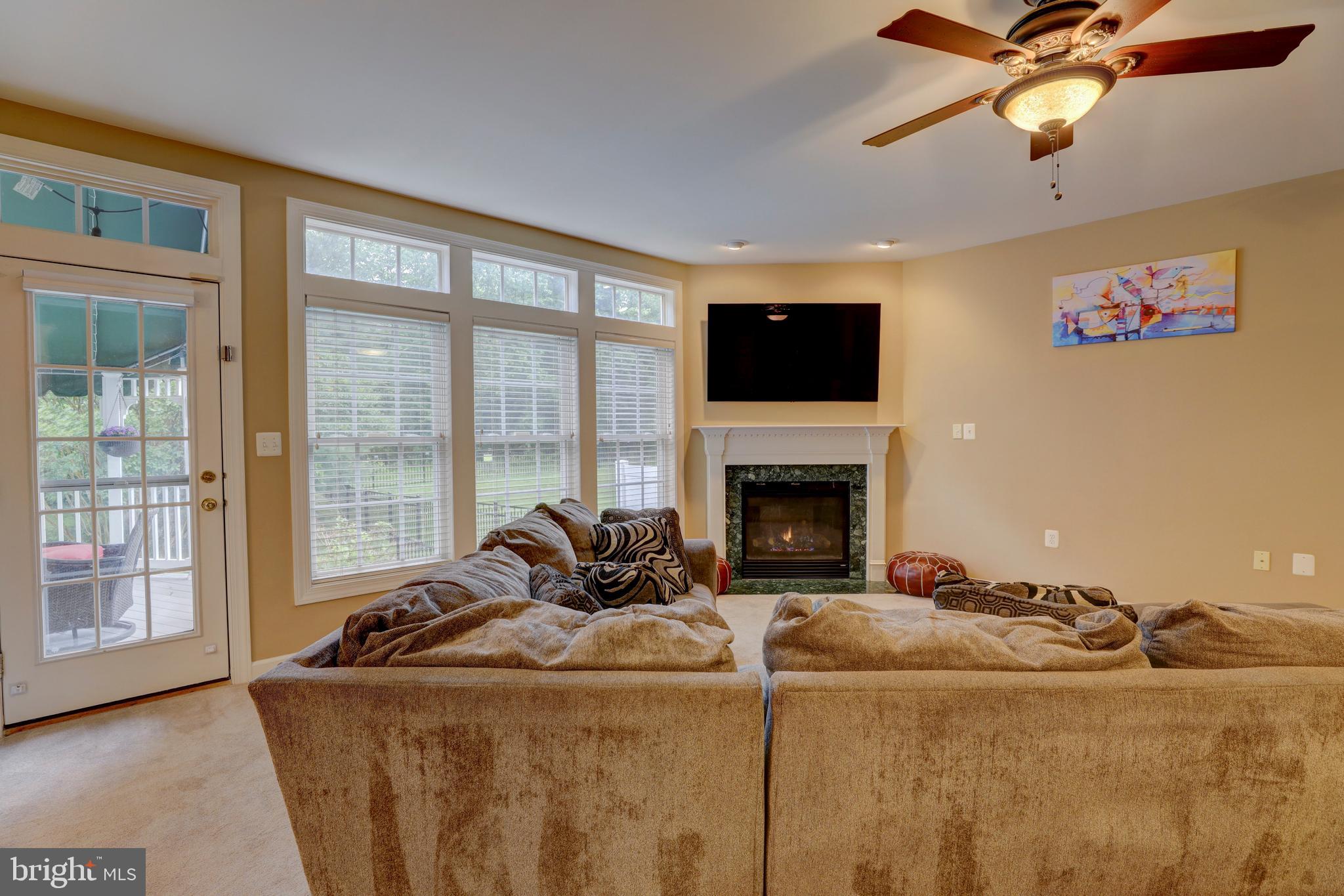 9124 Back Drop Drive Perry Hall, MD 21128 - Photo 11 of 69 a living room with furniture fireplace and a flat screen tv