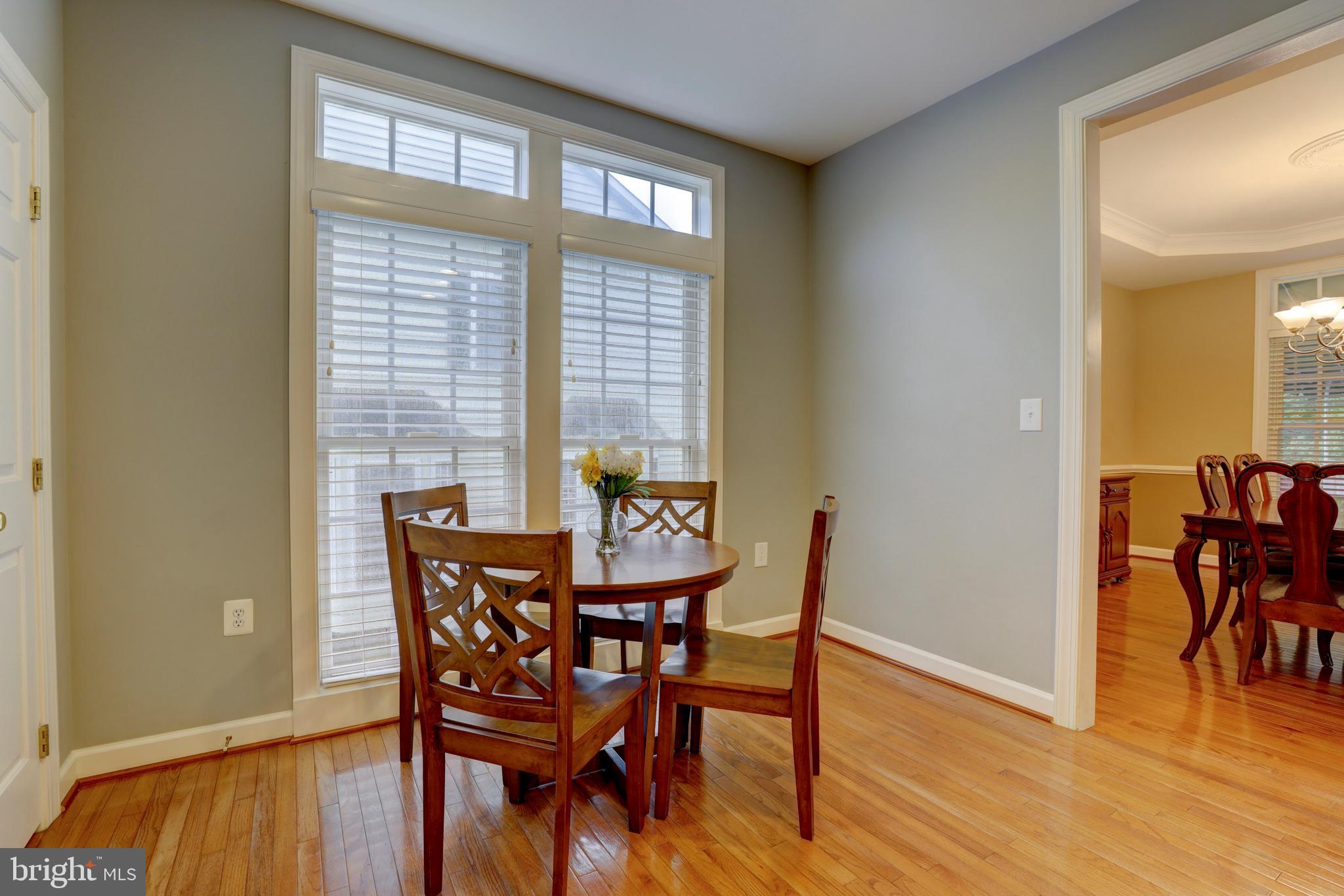 9124 Back Drop Drive Perry Hall, MD 21128 - Photo 22 of 69 a view of a dining room with furniture and wooden floor