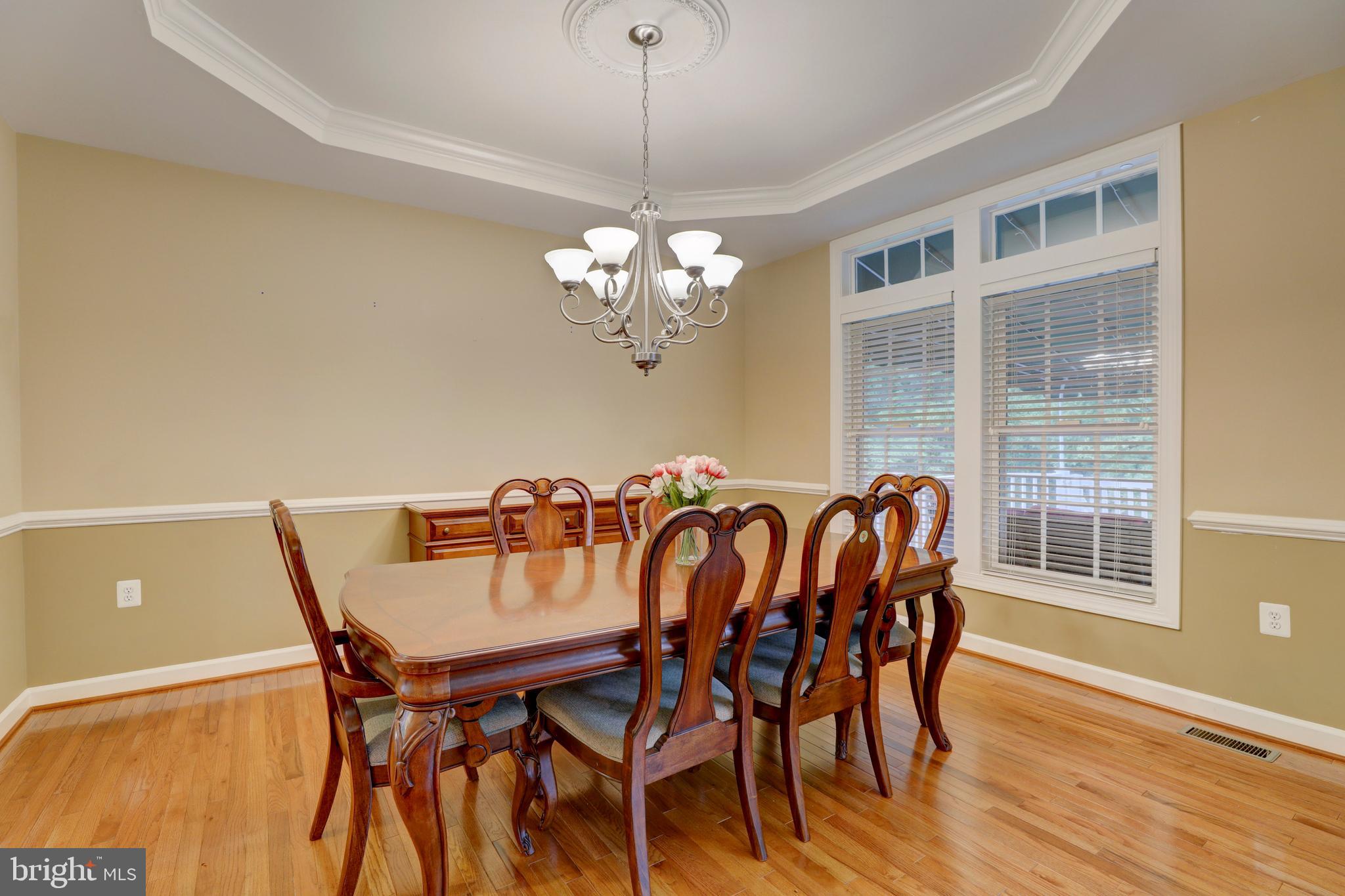 9124 Back Drop Drive Perry Hall, MD 21128 - Photo 25 of 69 a dining room with furniture a chandelier and wooden floor